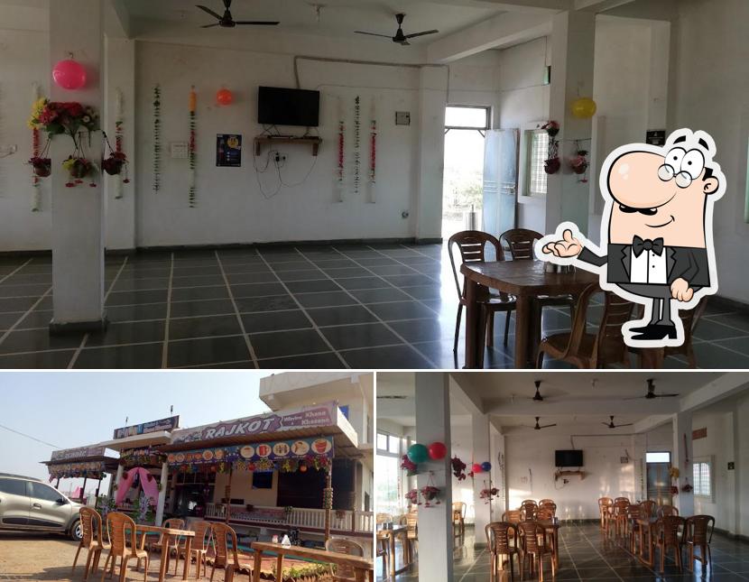 Take a seat at one of the tables at Rajkot Hills View And Khana Khajana