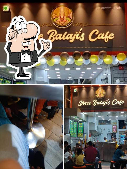 This is the photo showing interior and dining table at Shree Balaji's cafe