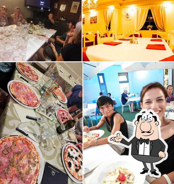 Dai un'occhiata agli interni di Pizzeria all'Albera