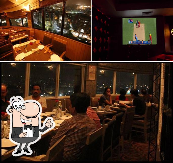 Take a seat at one of the tables at Ssky Bar & Lounge