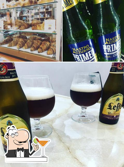 Dai un’occhiata alla foto che presenta la bevanda e cibo di Bar Europa