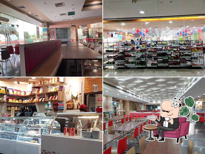 Take a seat at one of the tables at Haldiram's - MSX Mall