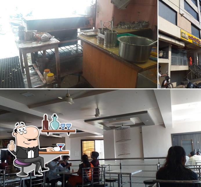 Check out the picture displaying interior and exterior at Radhe-Govind Tiffin Centre