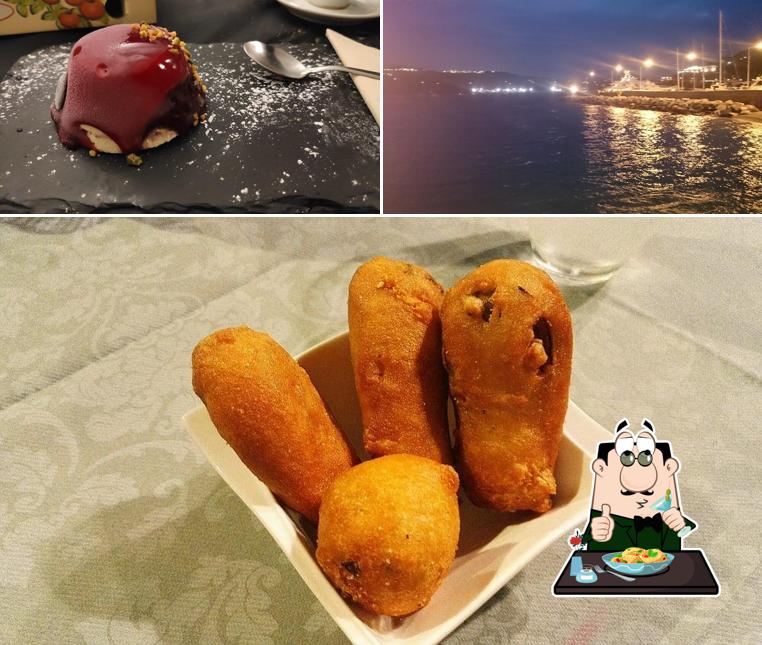 Guarda la foto che raffigura la cibo e esterno di Pizzeria l'Arte Bianca