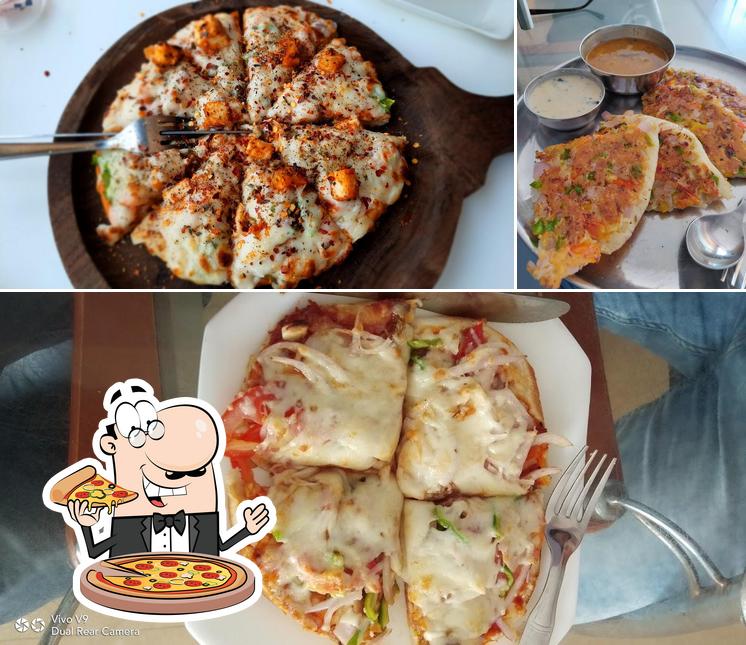 Pick pizza at Panchamritam Bakery Sweets Restaurant