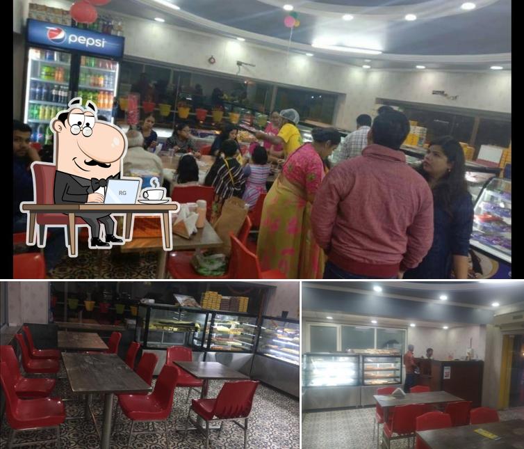Take a seat at one of the tables at Mithaiwala (MW56)