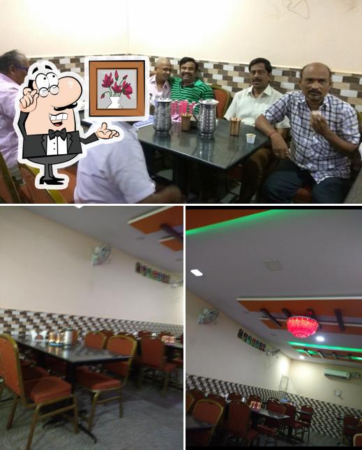 Take a seat at one of the tables at Shankar Vilas Family Restaurant