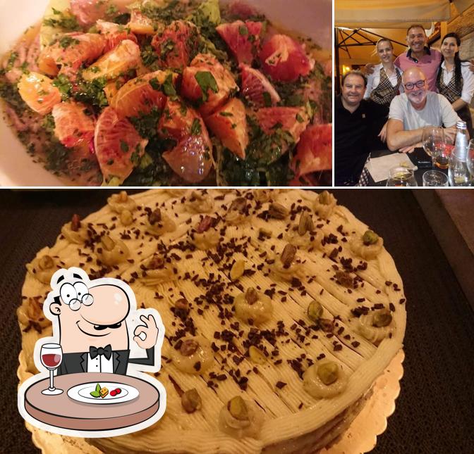 Questa è la foto che mostra la cibo e bancone da bar di Taverna Montalbano