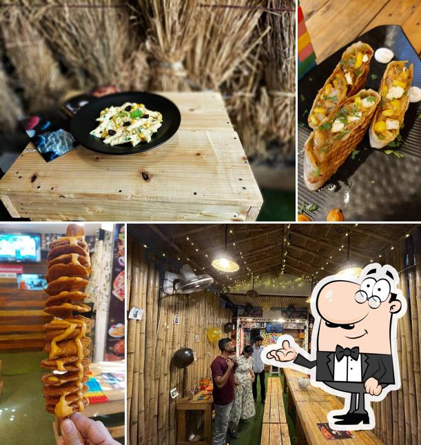 Take a seat at one of the tables at FoodCosta - Thane