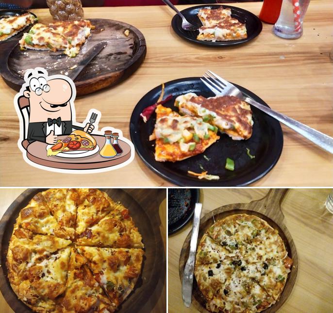 Try out pizza at White Sugar Restro Cafe