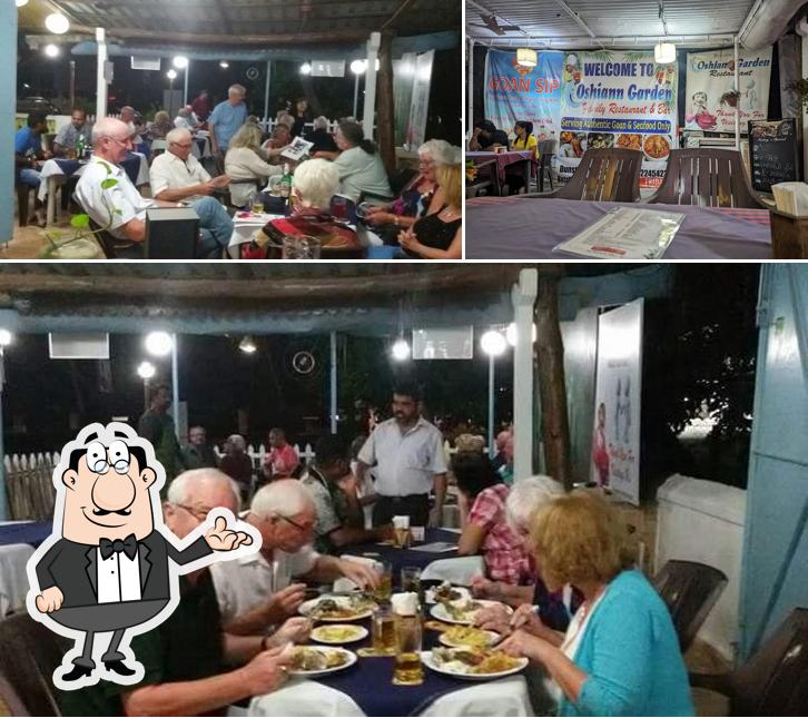 Take a seat at one of the tables at Oshiann Garden Restaurant