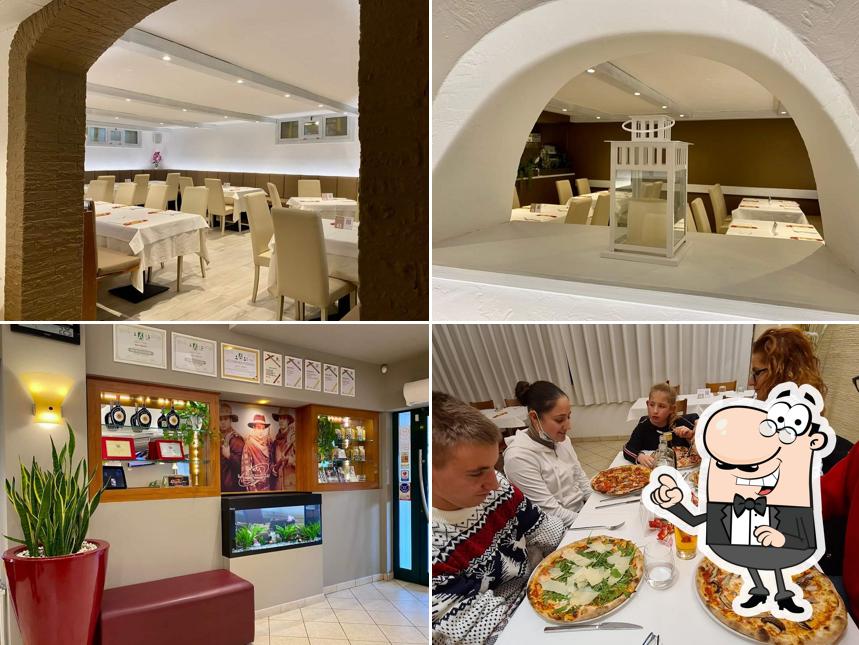 Dai un'occhiata agli interni di Pizzeria La Tavernetta