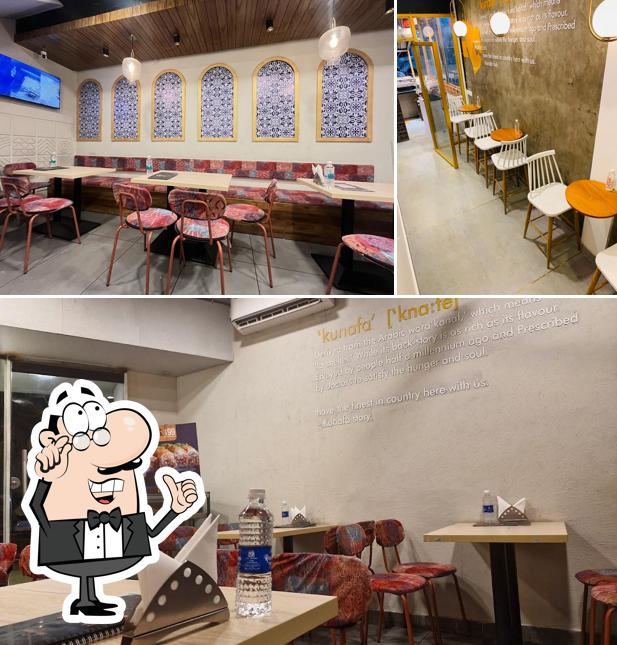 Take a seat at one of the tables at Kunafa Story