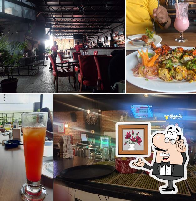 Take a seat at one of the tables at Sherlock's Lounge & Kitchen Nagarbhavi