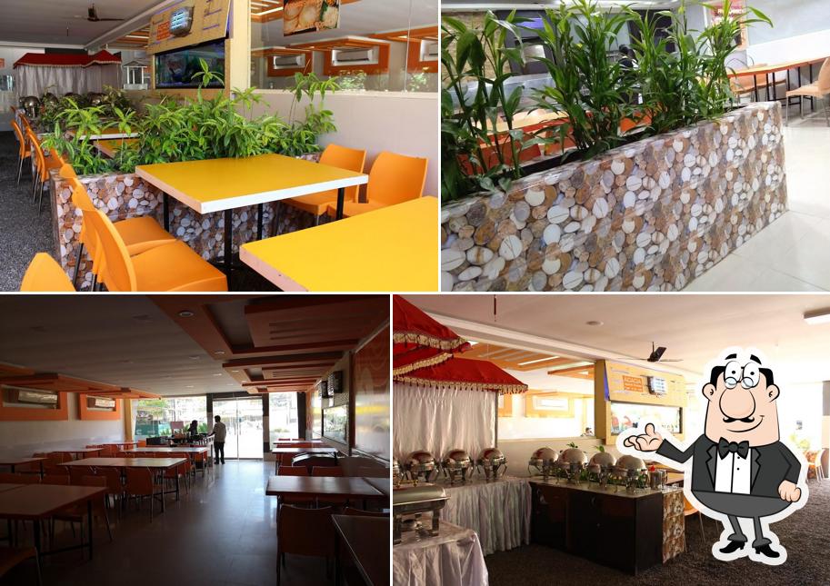 Take a seat at one of the tables at Aariyas Vegetarian Restaurant