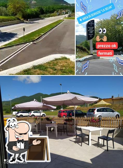 La foto della esterno e tavolo da pranzo di Area di servizio La Selva