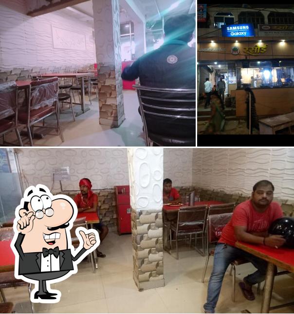 Take a seat at one of the tables at Rasoi Restaurant