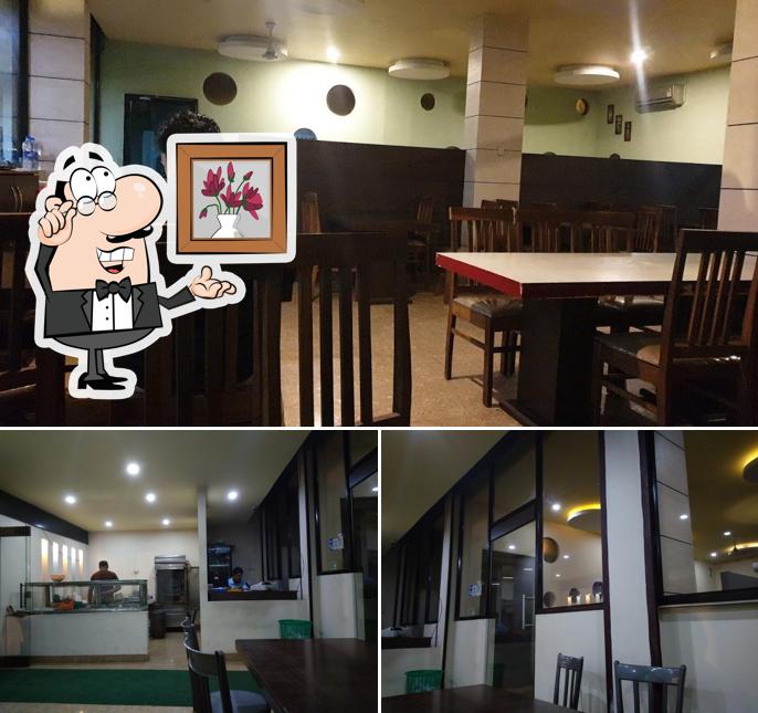 Take a seat at one of the tables at Tandoor Hut Restaurant