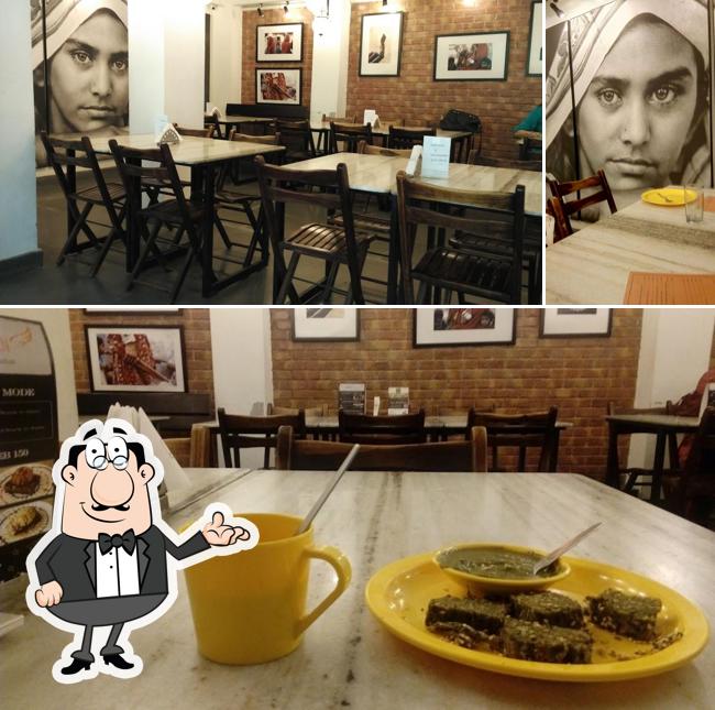 Take a seat at one of the tables at Amdavadi Gujarati Snack House