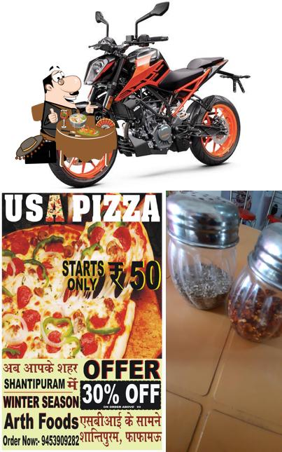 This is the picture displaying food and exterior at USA PIZZA