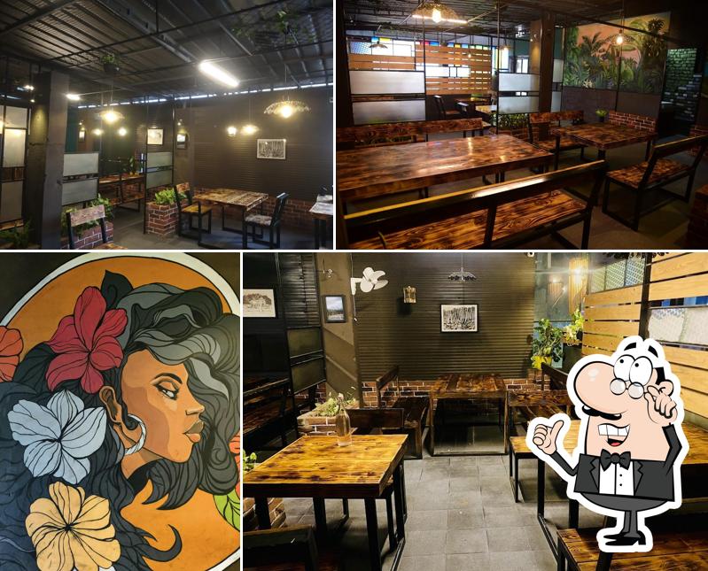 Take a seat at one of the tables at Porch Grill Nedumkandam