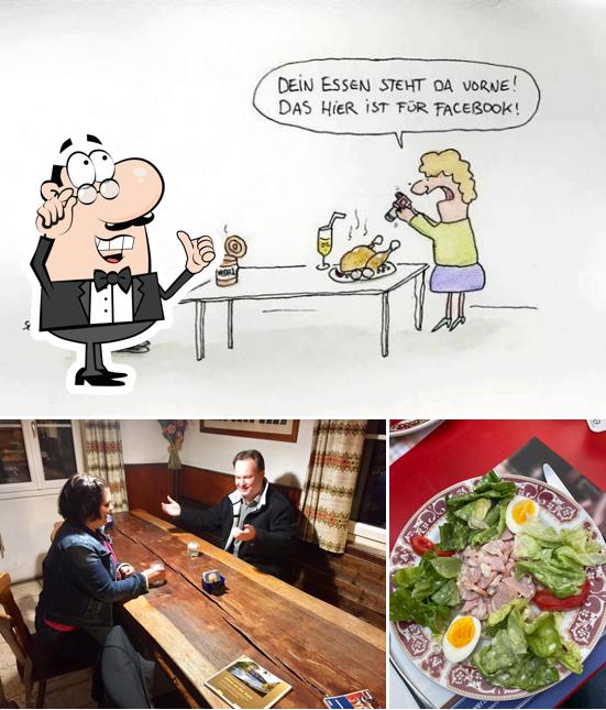 La immagine di interni e la carne da Restaurant Dézaley