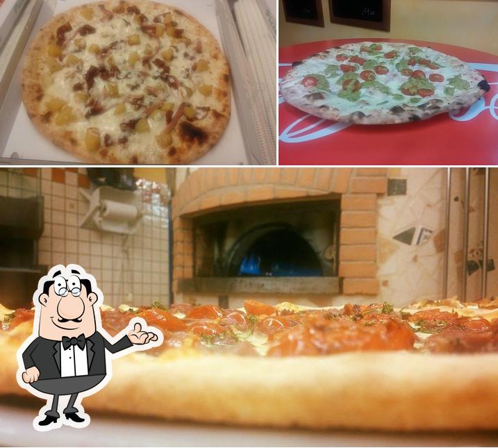 Questa è la foto che mostra la interni e pizza di Pizzeria D Asporto Di Bean Candido
