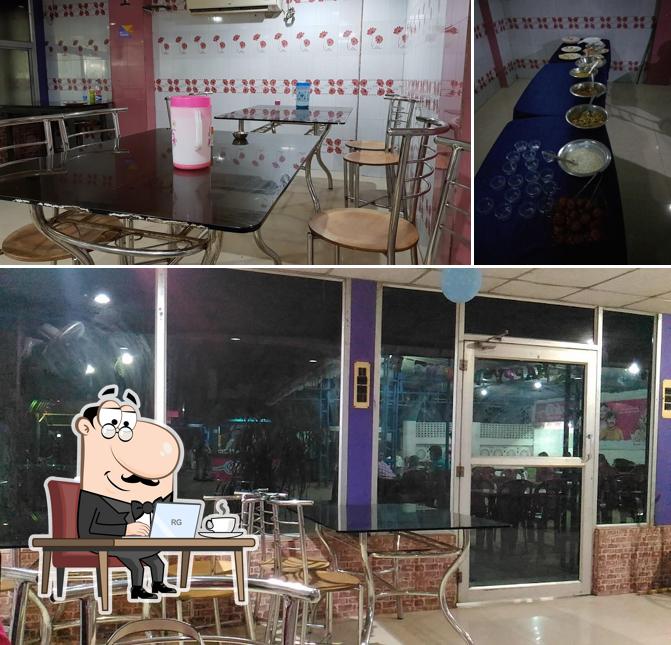 Take a seat at one of the tables at Sahara Restaurant