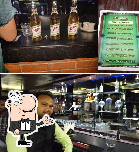 Take a seat at one of the tables at Xtreme Sports Bar