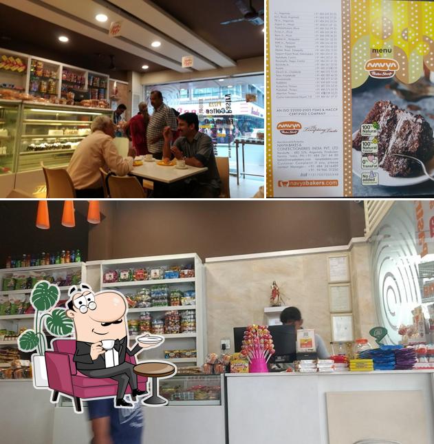 Take a seat at one of the tables at Navya Bake Shop, Aluva