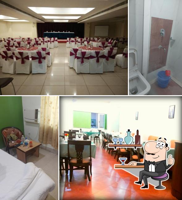 Take a seat at one of the tables at Hotel Bodhgaya Gautam Best Hotel in Bodh Gaya