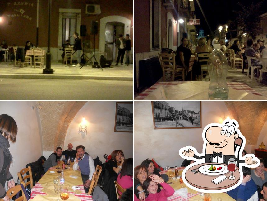 Questa è la foto che mostra la tavolo da pranzo e interni di Pizzeria Il Tagliere