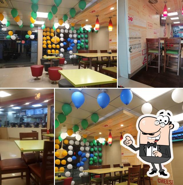 Take a seat at one of the tables at Domino's Pizza Amdi Mandir, Durg