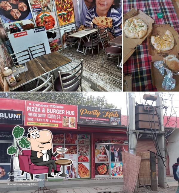 This is the picture depicting interior and food at Pizza & Burger Hub