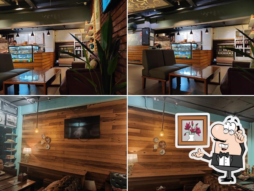 Take a seat at one of the tables at Barista Cafe & Lounge