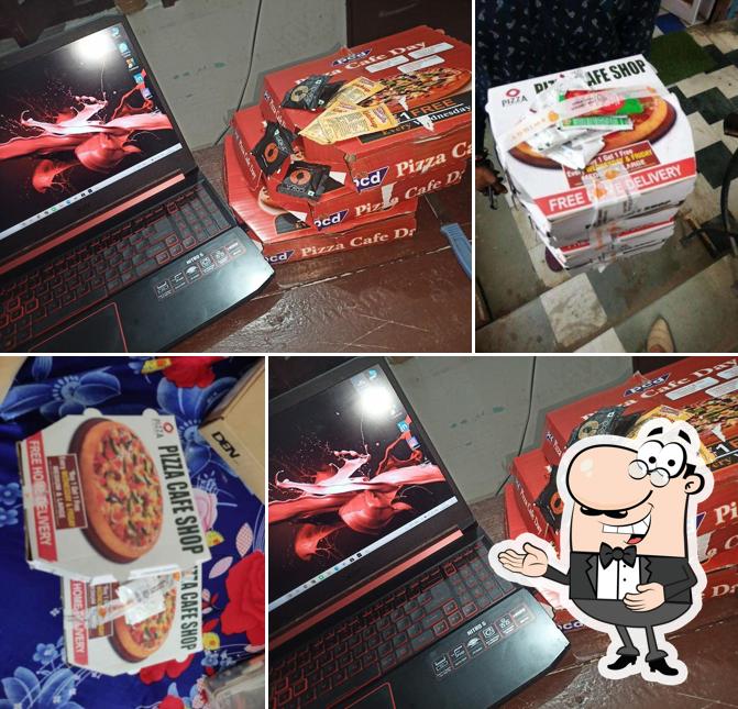 Look at the picture of Pizza Cafe Shop