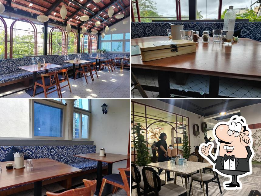Take a seat at one of the tables at White Garden - Vegetarian Artisan Kitchen