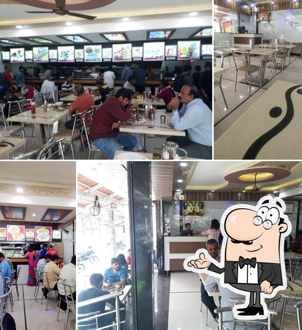 Take a seat at one of the tables at New Udupi Grand