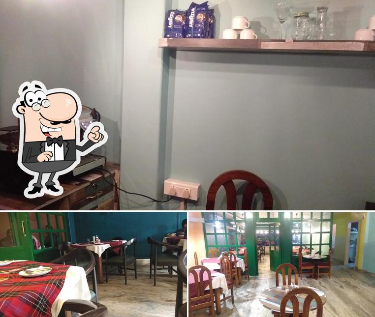 Take a seat at one of the tables at Hotel Shivali