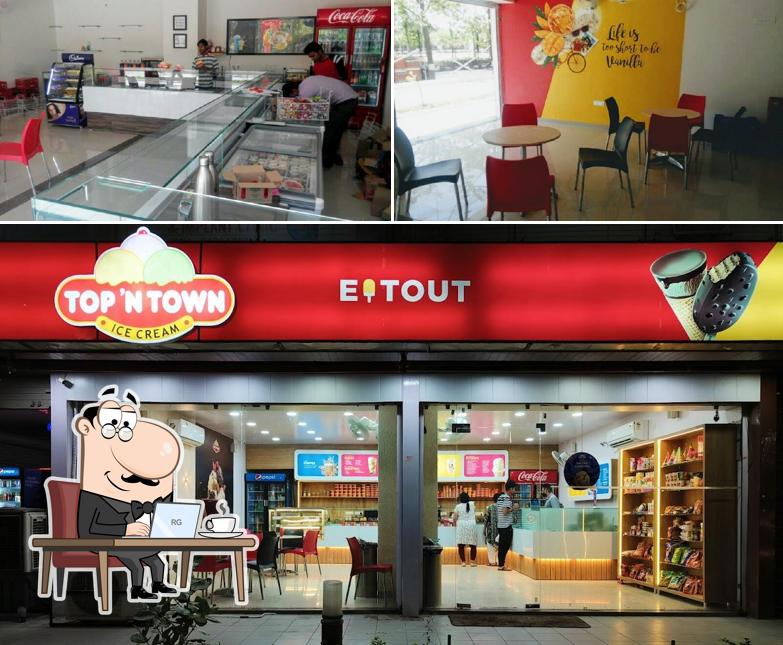 Take a seat at one of the tables at Eat Out (Top N Town)