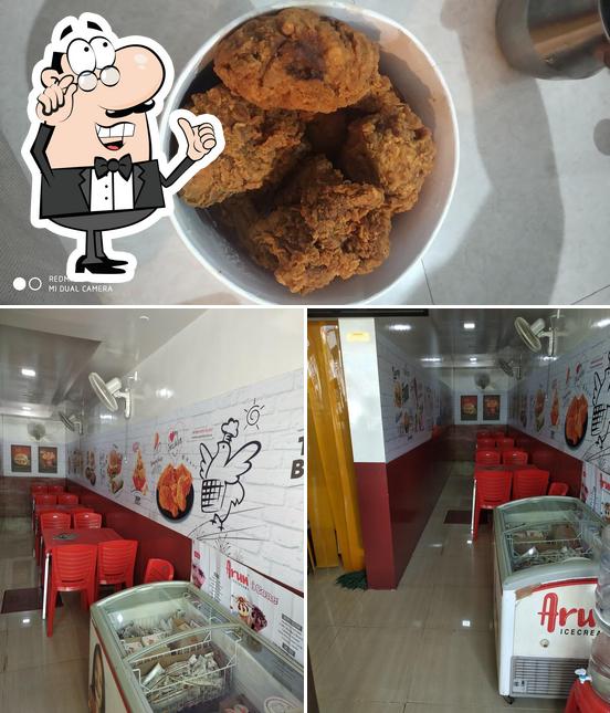 Among different things one can find interior and food at Five Star Chicken Tilak Nagara main road Dargha complex Shimoga