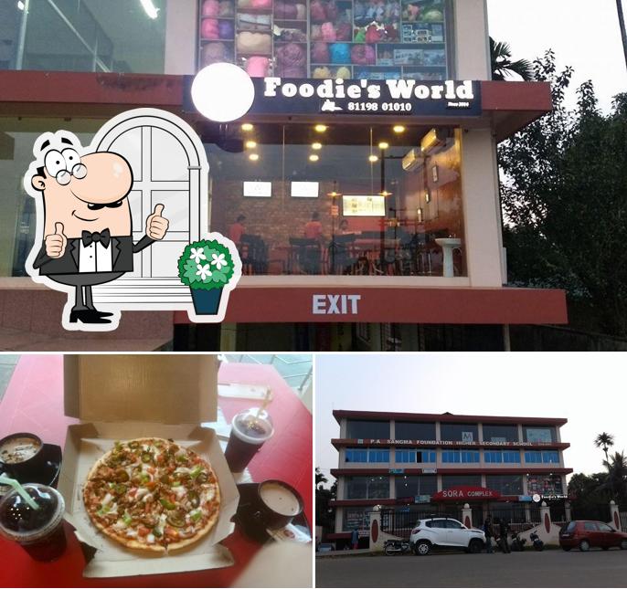 This is the picture displaying exterior and pizza at Foodie's Hub Tura