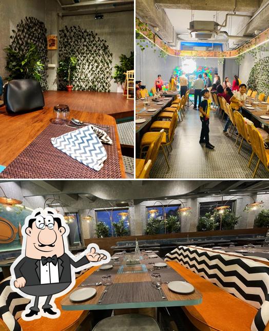Take a seat at one of the tables at Grill Kitchen Manjalpur
