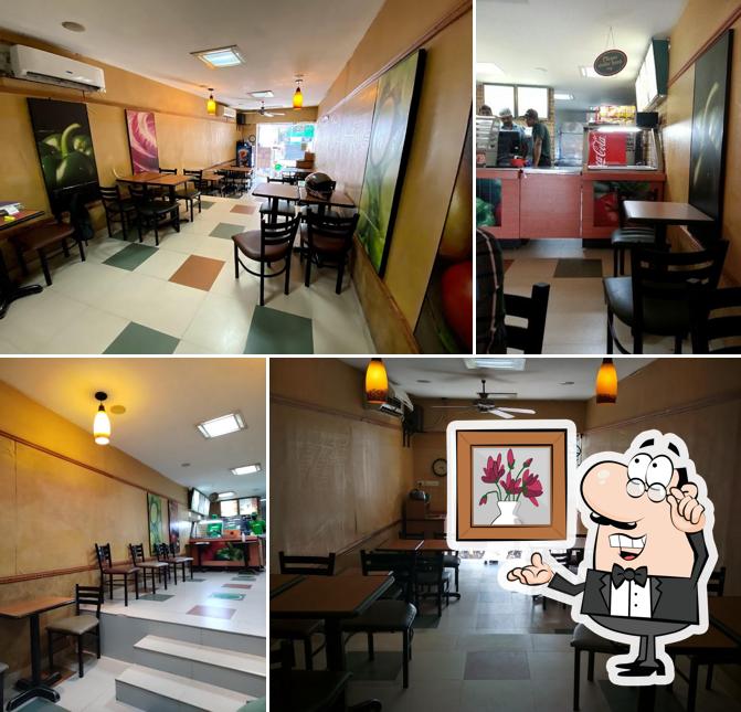 Take a seat at one of the tables at Subway Keston Road