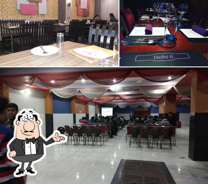 Take a seat at one of the tables at Dilli-6 Restaurant