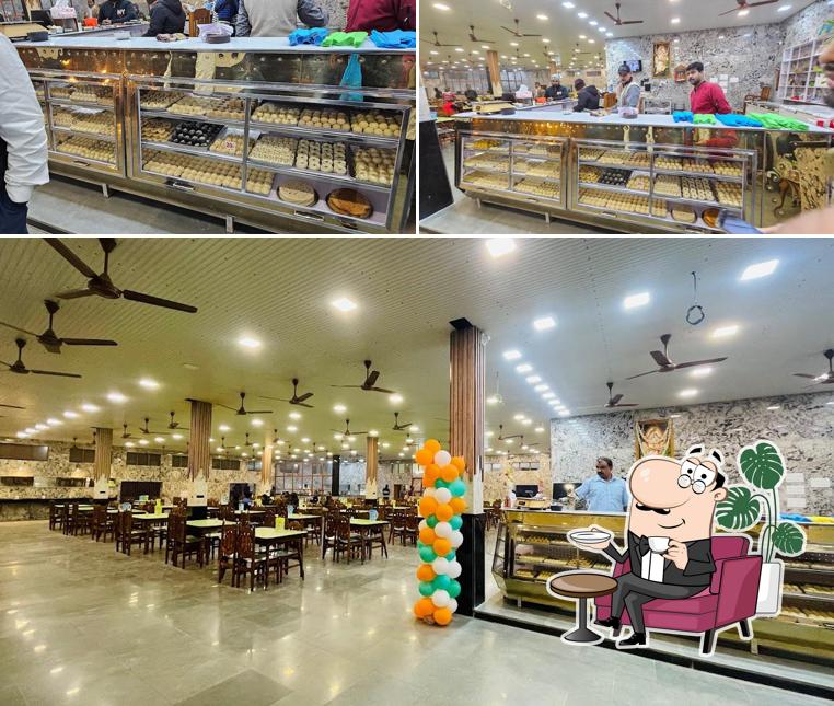 Take a seat at one of the tables at SANKAR MISTANNA PRATISTHAN