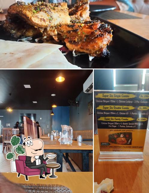 Check out the image showing interior and food at Khalids Biriyani - Namakkal