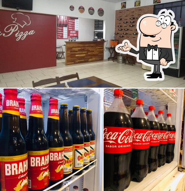 Entre diversos coisas, interior e bebida podem ser encontrados a Pizzaria Lá Pizza