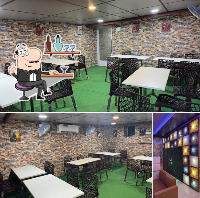 The interior of BAR & RESTAURANT CAFE PURE VEG AC FAMILY RESTRO