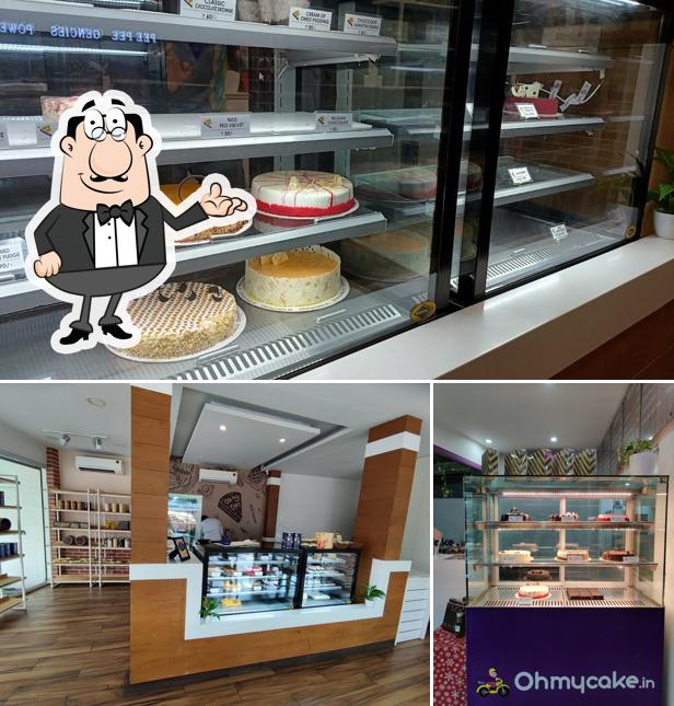 Take a seat at one of the tables at oh my cake Kakkanad